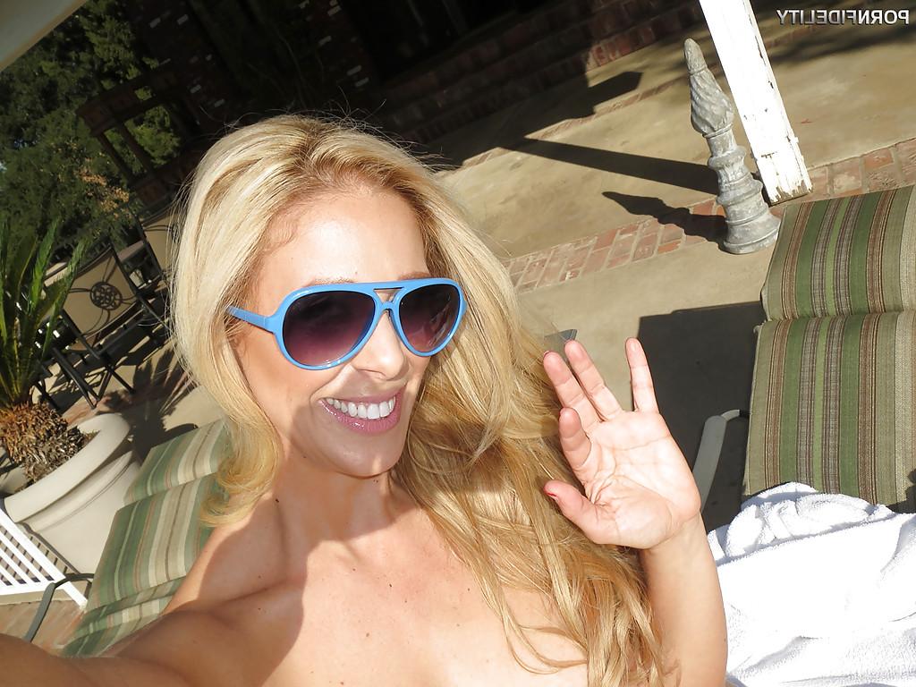 16P Outdoor posing scene featuring Cherie Deville, showing off in glasses