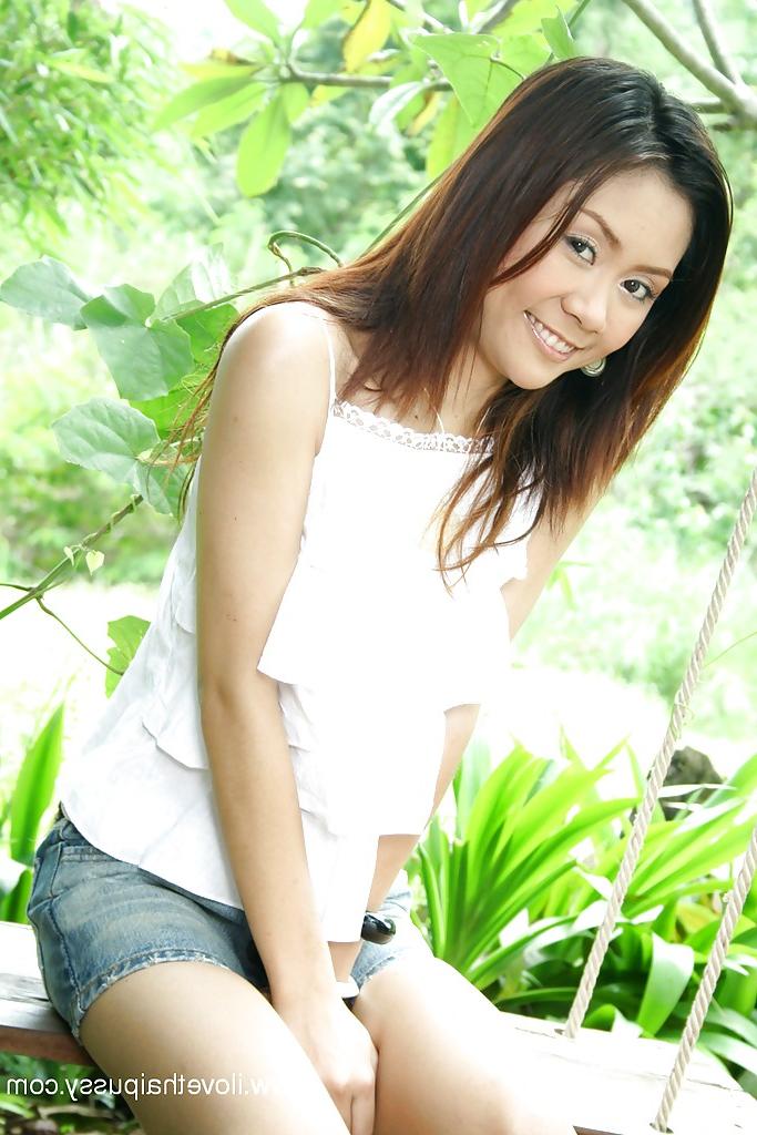 16P Asian cutie showing off her tiny titties and hairy poon outdoor
