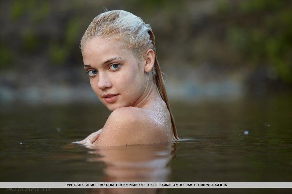 18P Gorgeous outdoor location graced by an alluring goddess, bathing and lounging uninhibitedly among the lush green grass, cool river and gnarly trees.