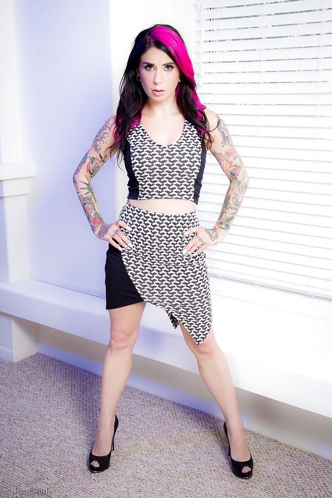 16P Inked model Joanna Angel striking alluring solo poses in dress and heels