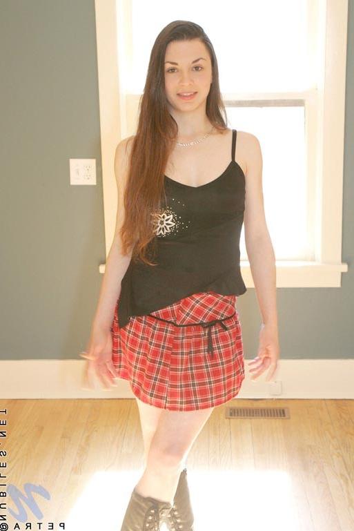 15P Alluring brunette chick petra gets horny and topless on camera
