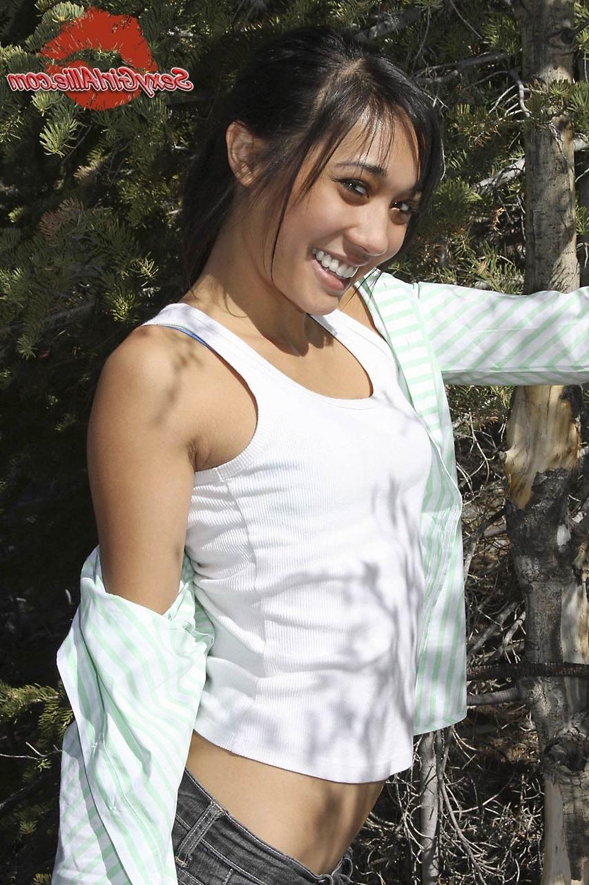 16P Skinny asian teen girl outdoors