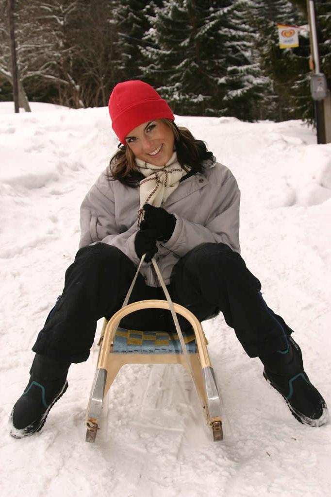 18P Horny brunette teen strips outdoors on a snow sled