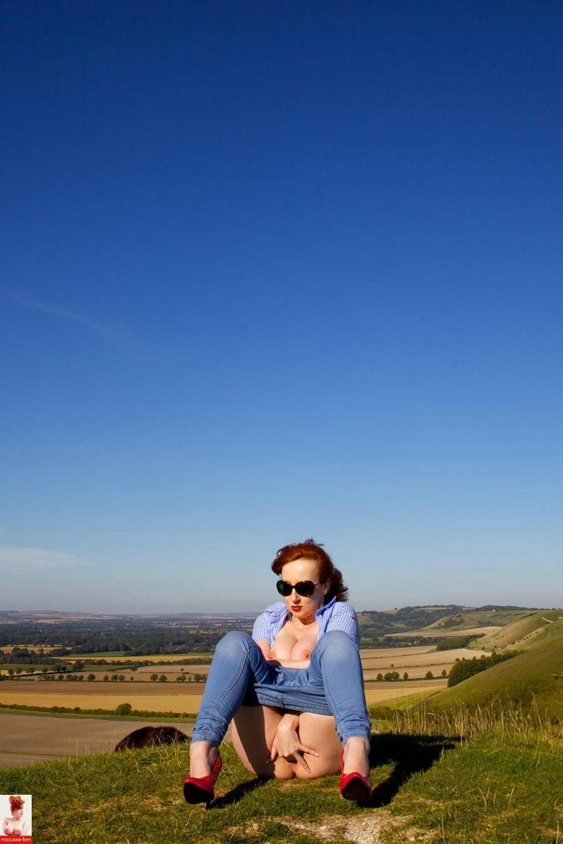 16P Busty pale redhead babe in sunglasses outdoors