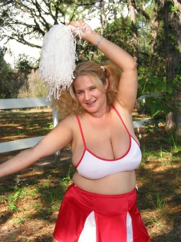 16P Huge boobs fat blonde in cheerleader uniform teasing outdoors
