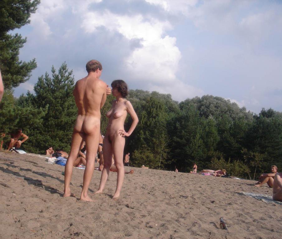 15P All eyes are on this young nudist as she sunbathes