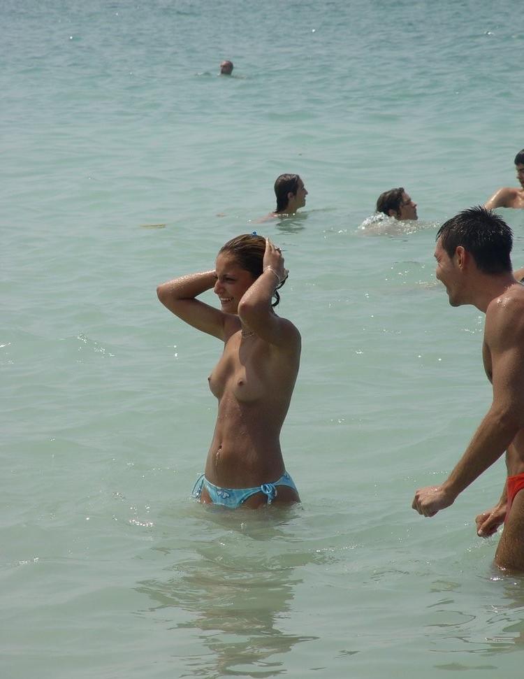 15P All eyes are on this young nudist as she sunbathes