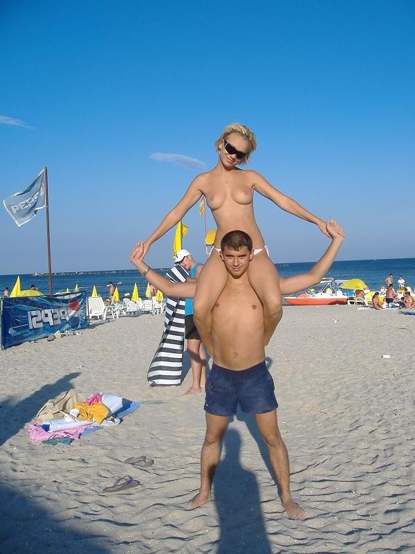 15P All eyes are on this young nudist as she sunbathes