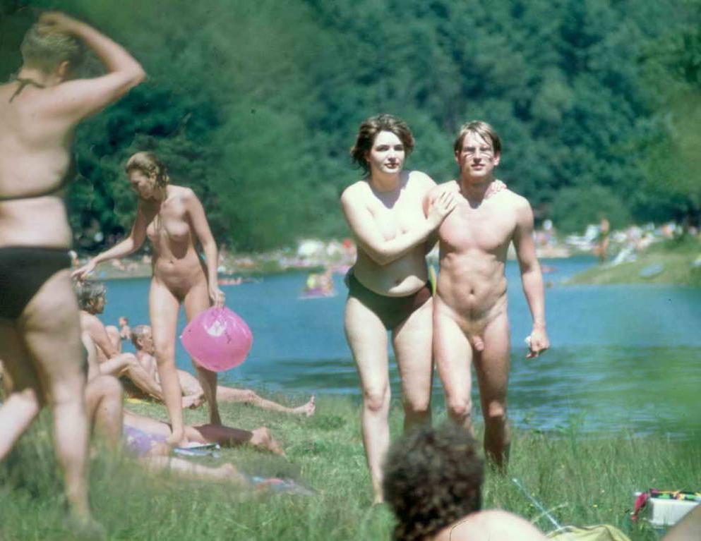 15P Curvy babe bares all at a nudist beach in the sun