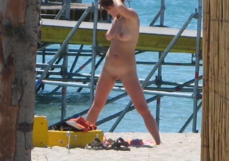 14P All eyes are on this big breasted nudist as she sunbathes