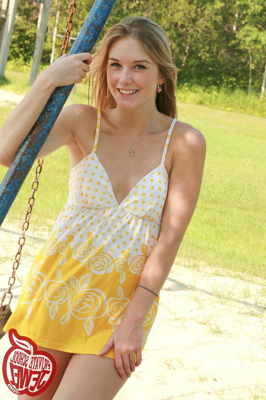 16P Cute blonde teen girl swinging outdoors