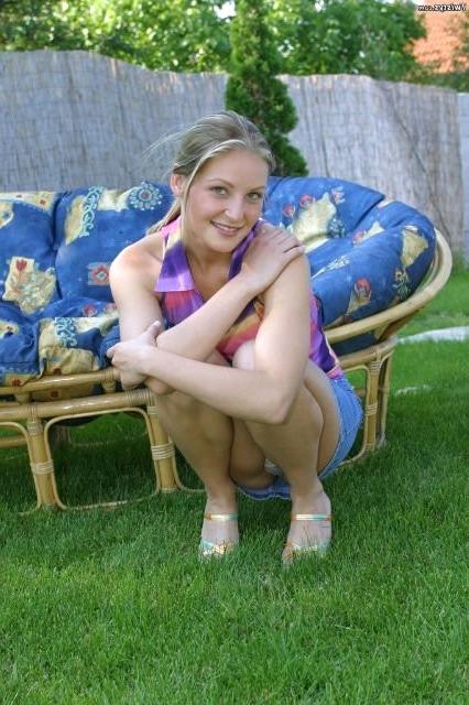 16P Sweet blonde babe posing outdoors
