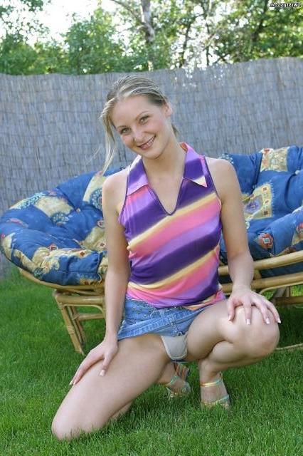 16P Sweet blonde babe posing outdoors