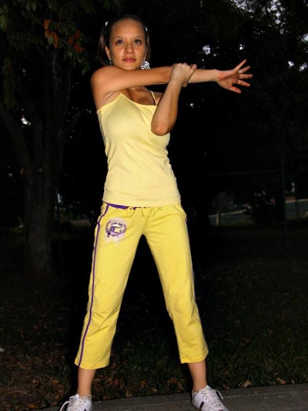 16P Sexy hispanic teen Paris Milan stretching outdoors