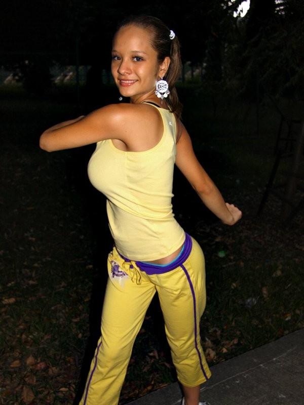 16P Sexy hispanic teen Paris Milan stretching outdoors