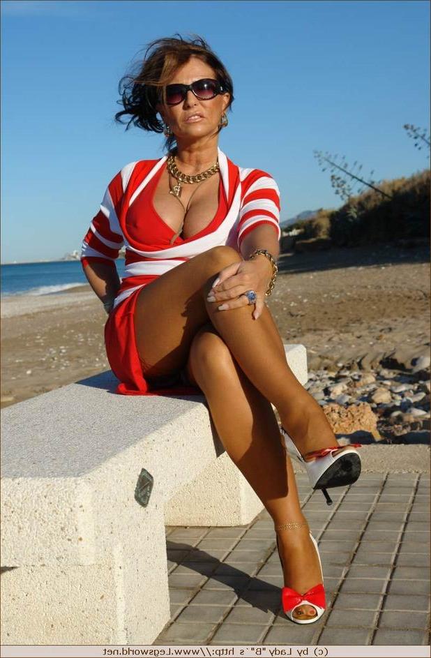 12P Leggy german lady in tan stockings outdoors