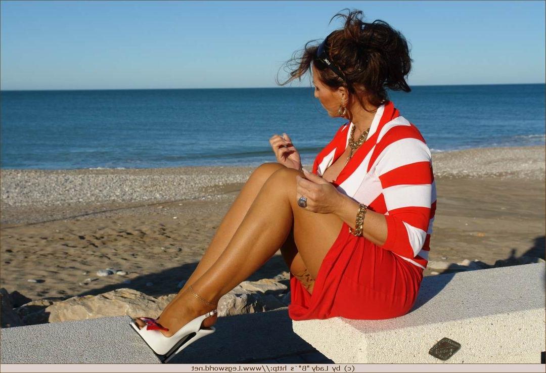 12P Leggy german lady in tan stockings outdoors