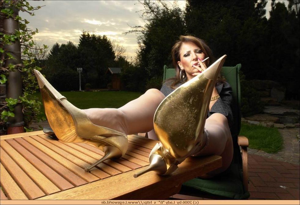 12P German lady in stockings smoking outdoors