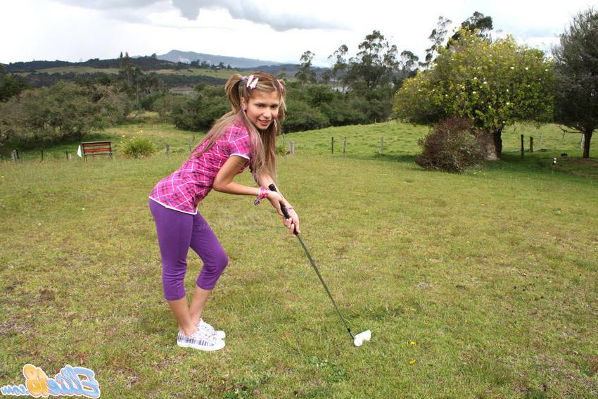 15P Cute tiny titted eighteen year old spreads outdoors on the grass