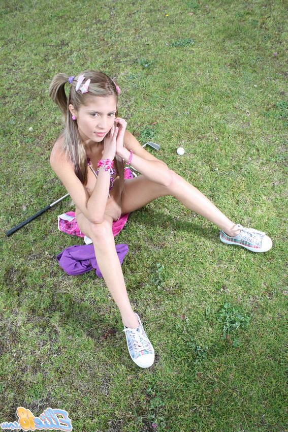 15P Cute tiny titted eighteen year old spreads outdoors on the grass