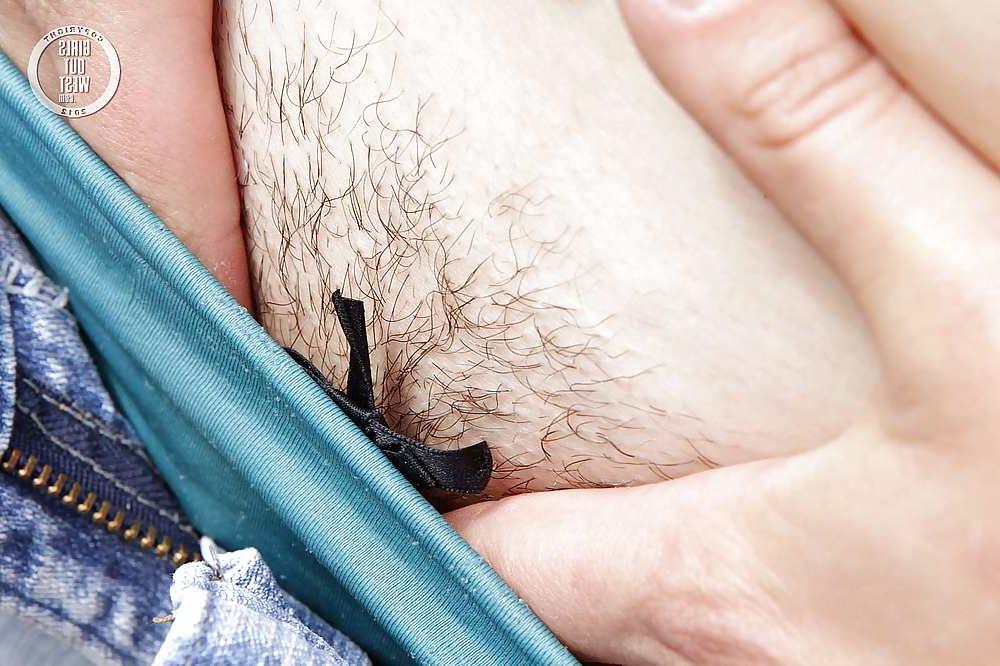 16P Busty amateur chick toys her hairy cunt outdoors