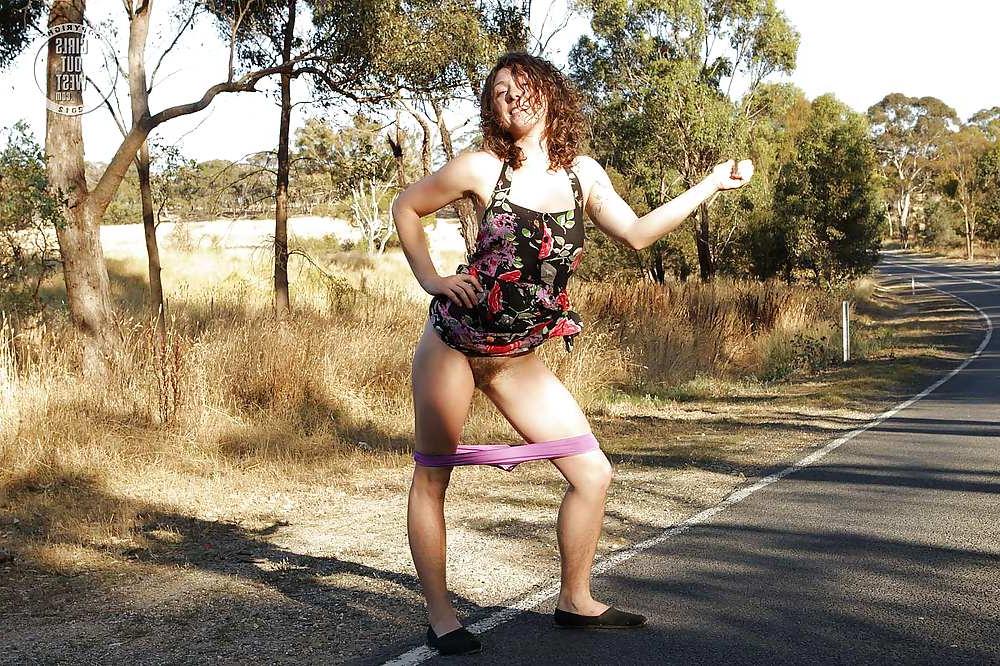 16P Sexy amateur brunette shows her hairy pussy on the road