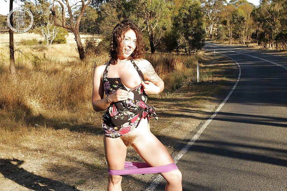 16P Sexy amateur brunette shows her hairy pussy on the road