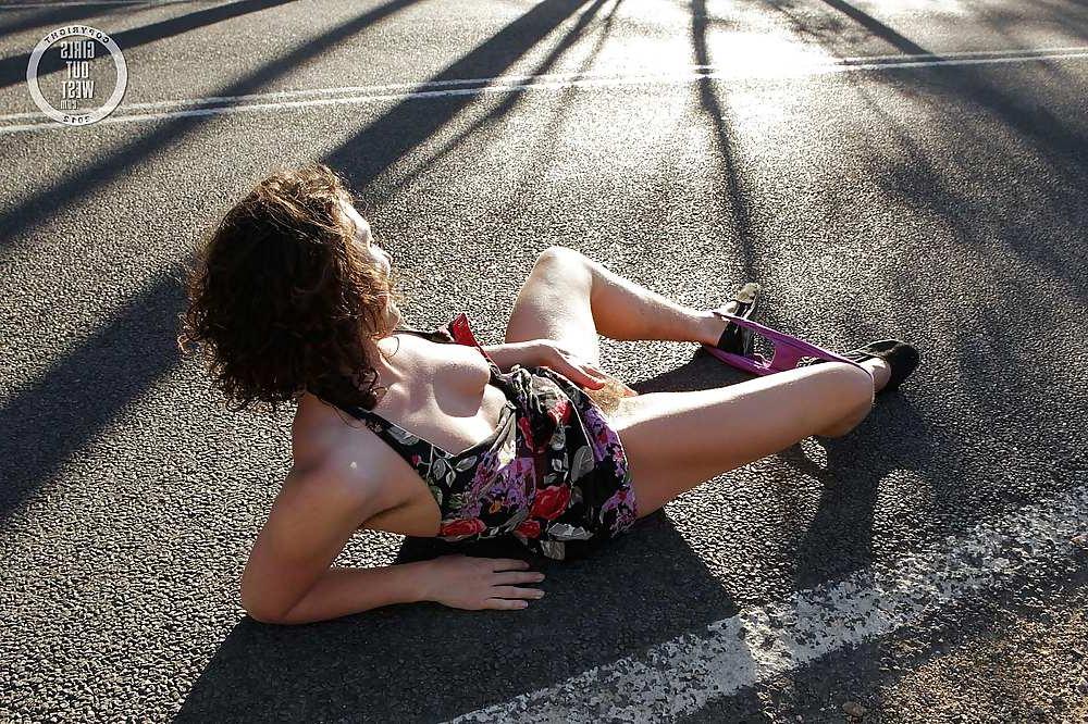 16P Sexy amateur brunette shows her hairy pussy on the road