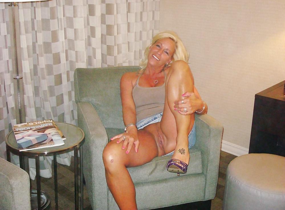 16P Nice blonde amateur mature with fake tits