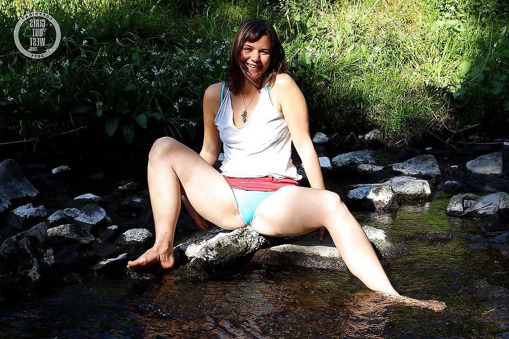 16P Small titted amateur spreads her hairy pussy in the river