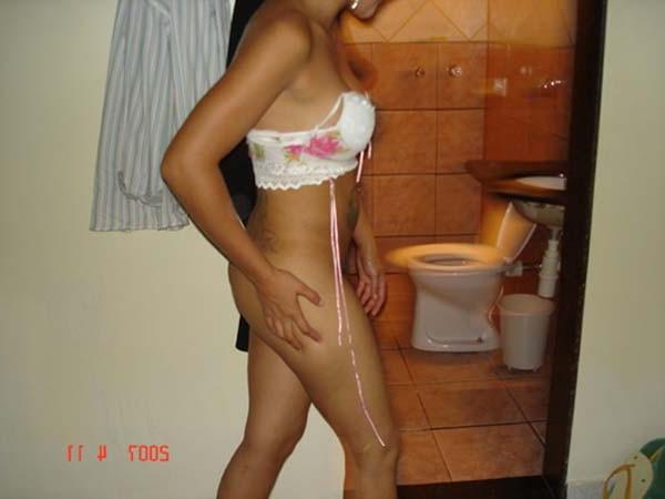 16P Horny Latina named Maria bares her titties pussy in bed for the camera then suck