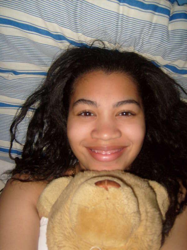 15P Pics of a cute Latina teen including her getting topless in bed and sucking some