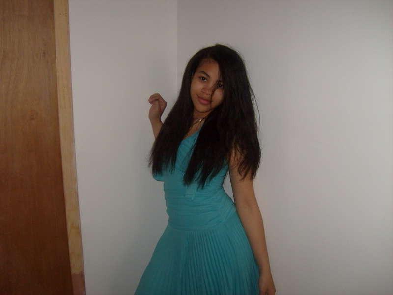 15P Pics of a cute Latina teen including her getting topless in bed and sucking some