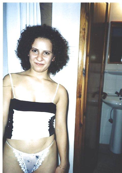16P Curly brunette amateur Tania posing