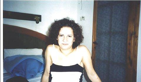 16P Curly brunette amateur Tania posing