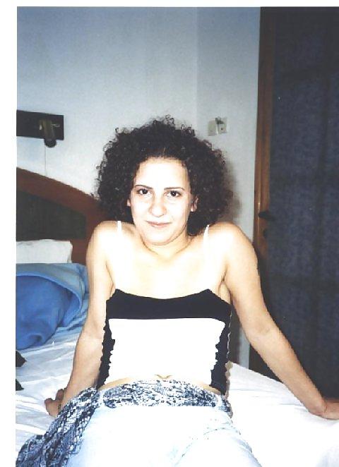 16P Curly brunette amateur Tania posing