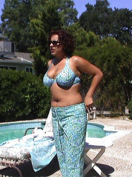 14P Buxom brunette amateur in the pool