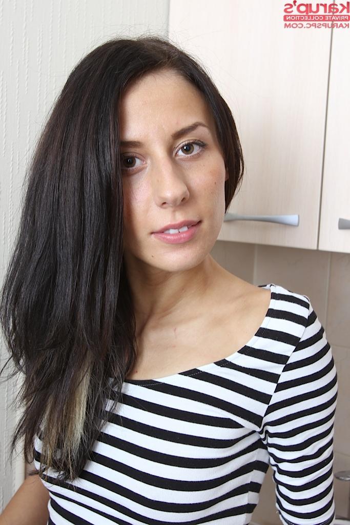 15P Skinny amateur Elizabete in stockings spreading to show nude pussy in kitchen
