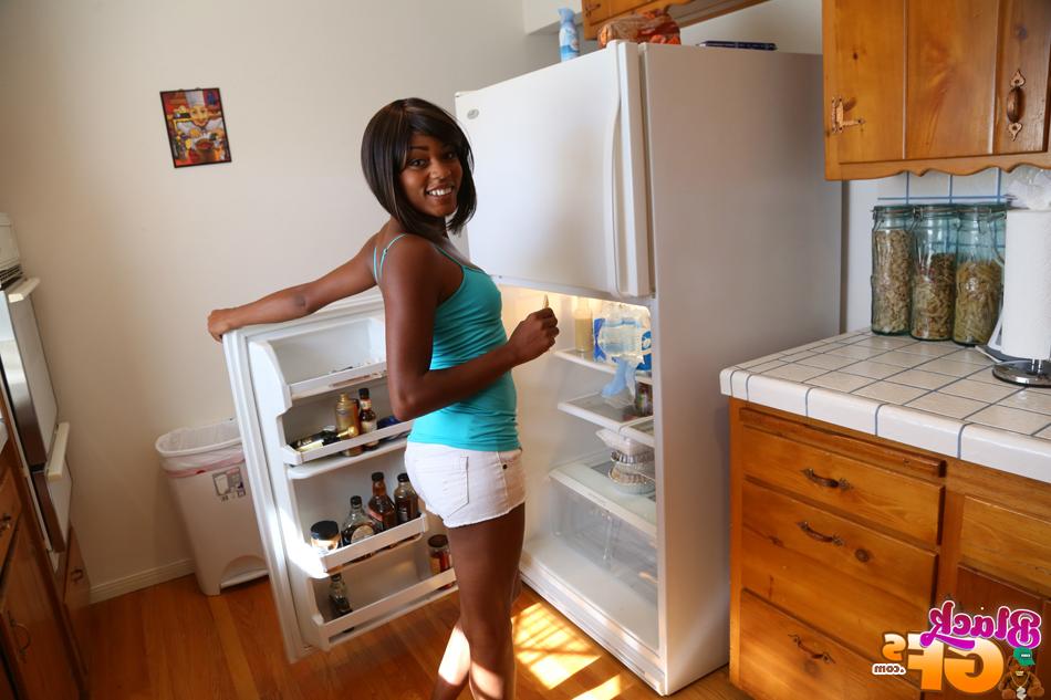 16P Amateur ebony Karma is posing hot in the living room like a pornstar