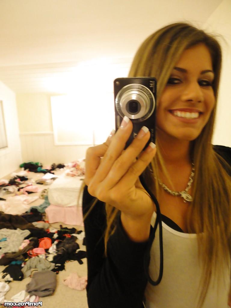 16P Amateur Bella Beyle strips to make some homemade shots in lingerie