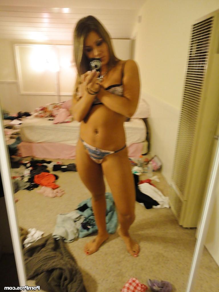 16P Amateur Bella Beyle strips to make some homemade shots in lingerie