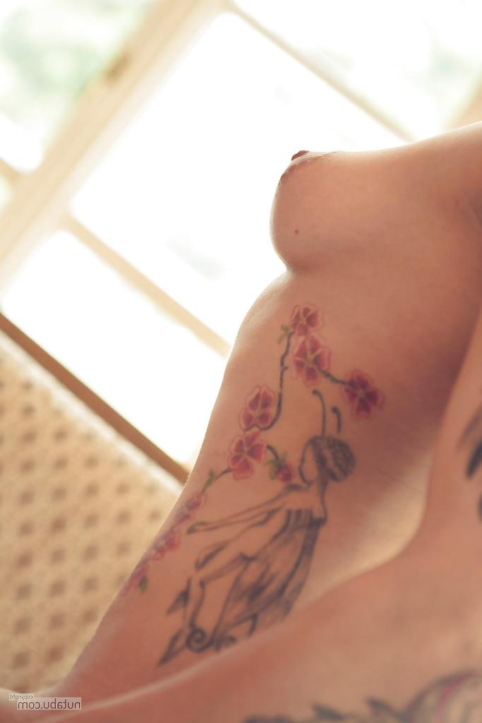 16P Amateur babe model with tattoos striking sexy poses in hose and high heels