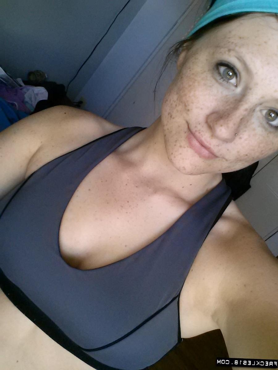 12P Pierced amateur Freckles takes self shot posing in shorts & sexy panties