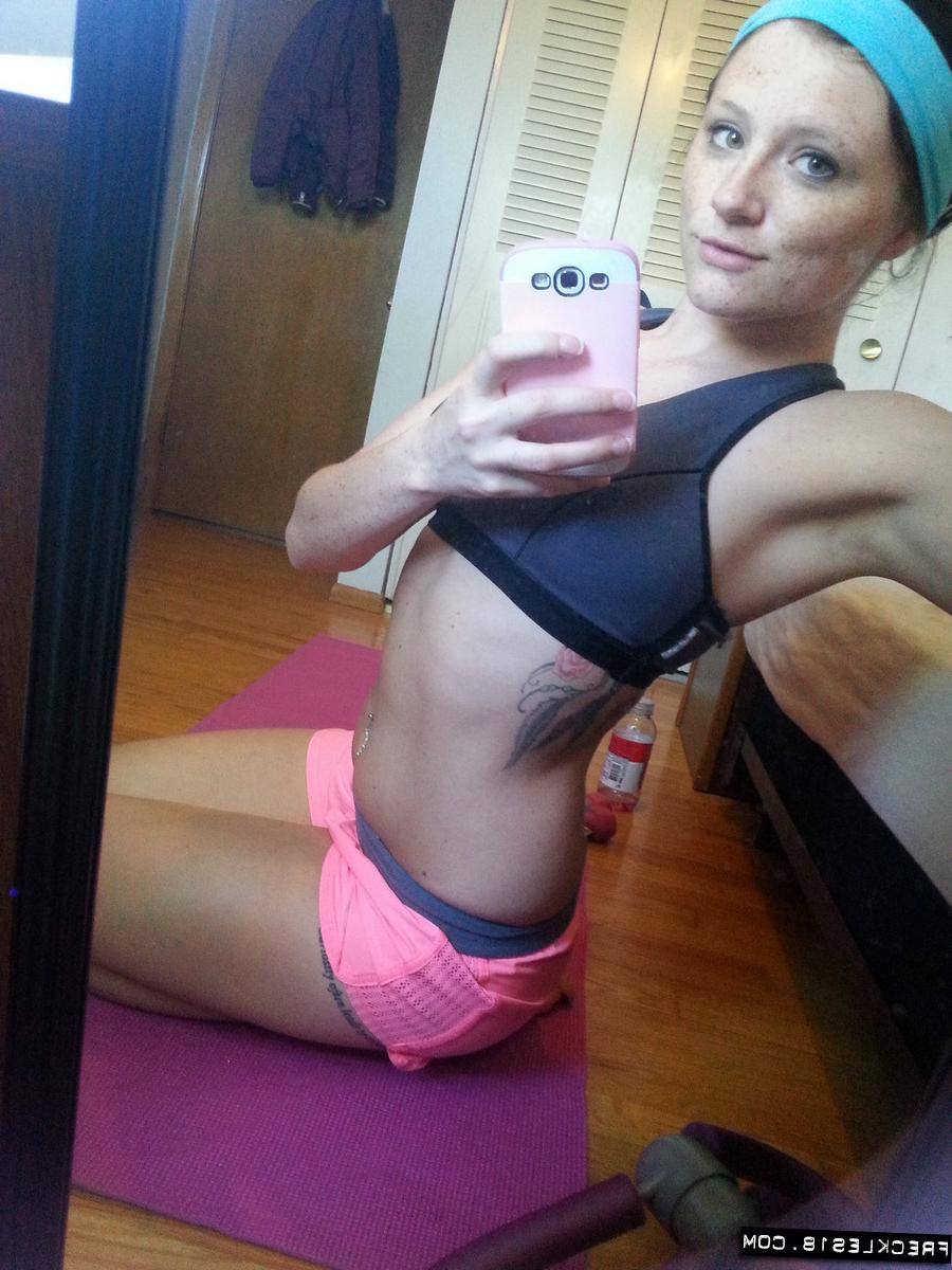 12P Pierced amateur Freckles takes self shot posing in shorts & sexy panties