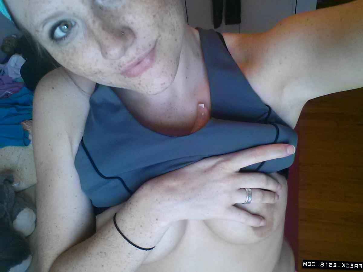 12P Pierced amateur Freckles takes self shot posing in shorts & sexy panties