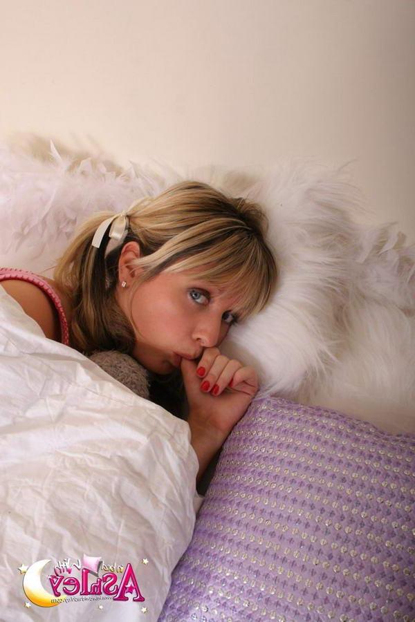 15P Pictures of teen nympho In Bed With Ashley showing you her big boobs