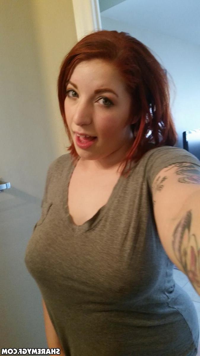 12P Busty redhead GF shows off her big natural tits as she takes selfies in the mirror