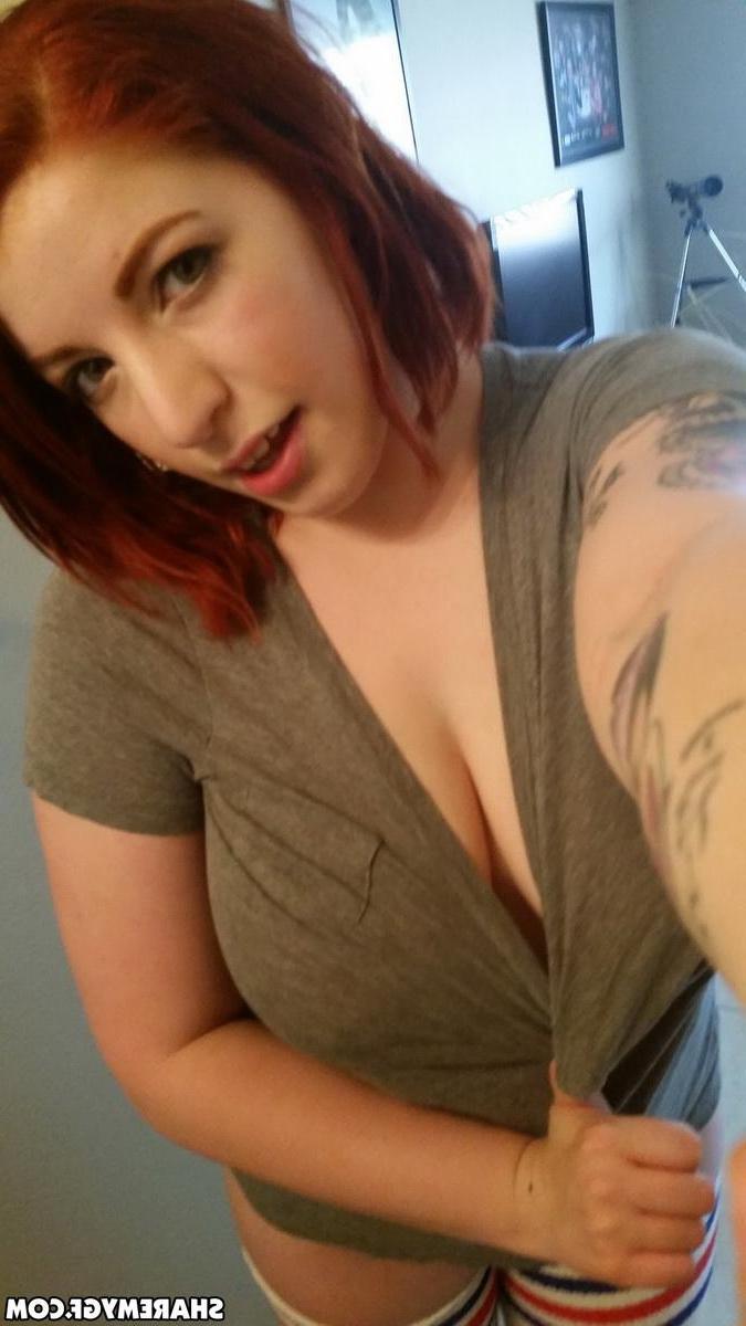12P Busty redhead GF shows off her big natural tits as she takes selfies in the mirror