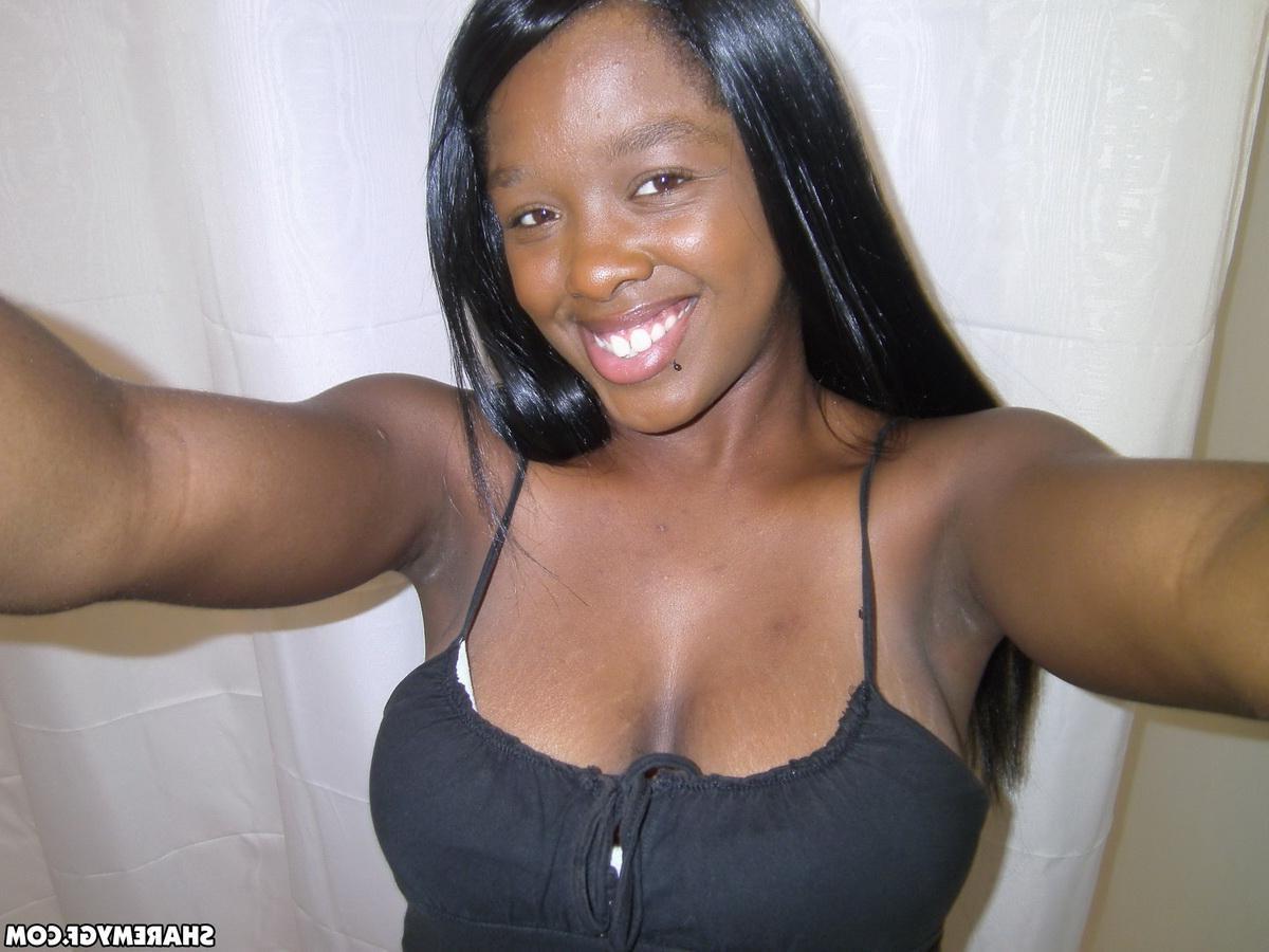 12P Busty ebony girlfriend takes selfshot pictures of her big tits in the mirror