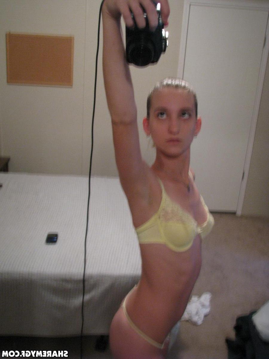 12P Skinny girlfriend takes selfshot pictures in the mirror of her perky tits in a yellow lace bra